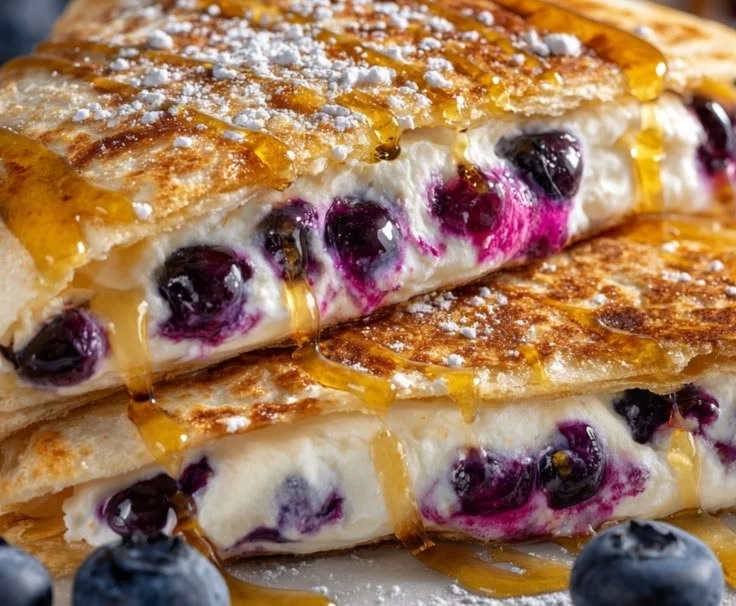Delicious blueberry breakfast quesadilla with fresh blueberries and melting cheese
