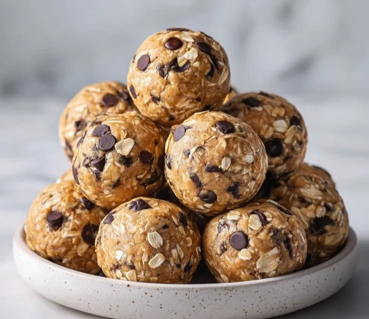Delicious cream cheese protein balls stacked on a plate.