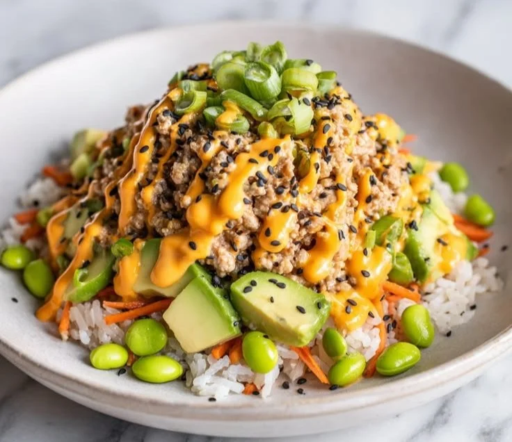 Ground turkey rice bowls topped with bang bang sauce, perfect for weeknight meals