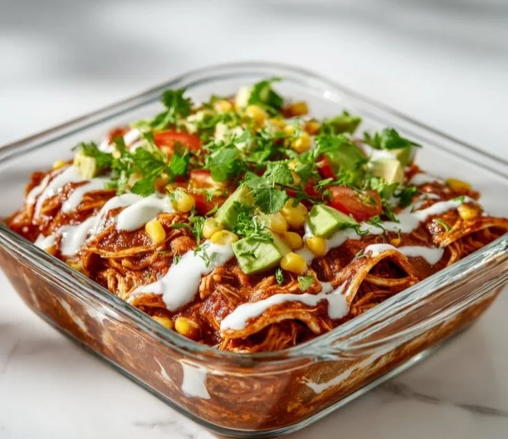 Protein-packed chicken enchilada bowl topped with fresh ingredients and spices