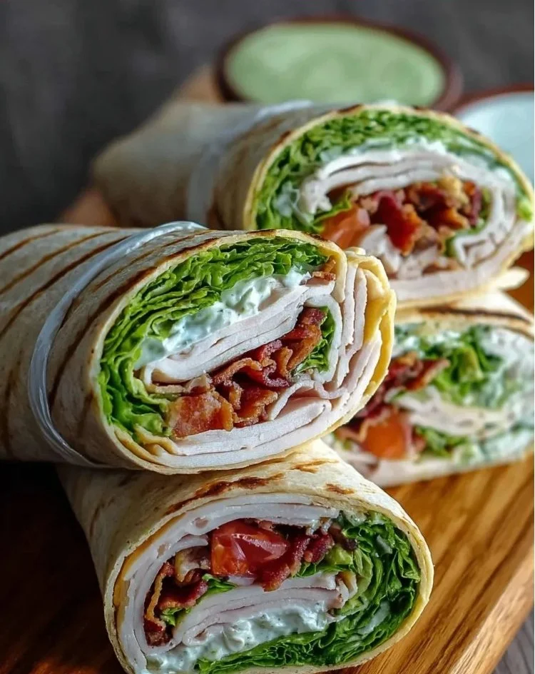 High-protein turkey club wraps filled with fresh ingredients and crunchy texture.