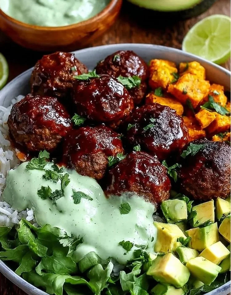 Healthy BBQ meatball bowls with avocado sauce served in a cozy setting