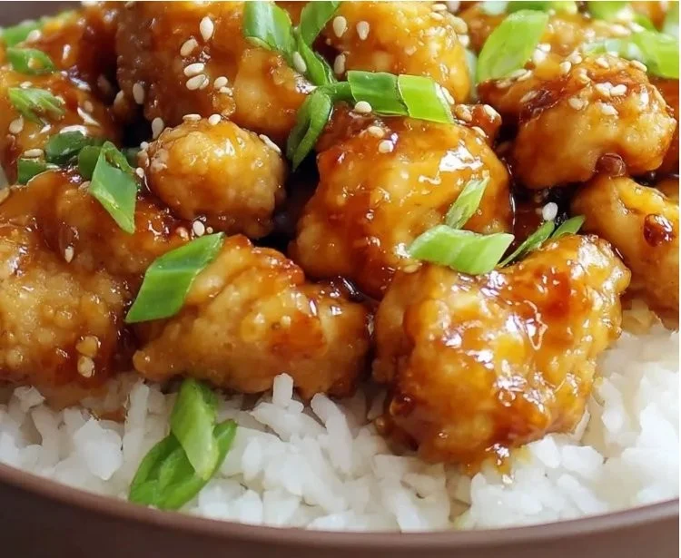 Crispy high protein orange chicken air fryer recipe served with vegetables
