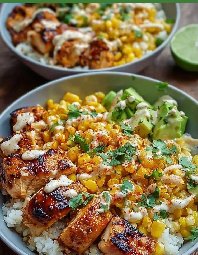 High-protein street corn chicken rice bowls topped with fresh ingredients