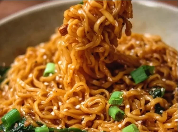 Bowl of protein-packed vegan ramen with colorful vegetables and toppings